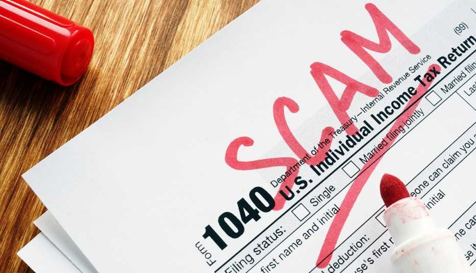 tax return form marked  as scam on a desk