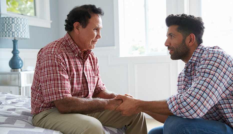 Son comforting adult father