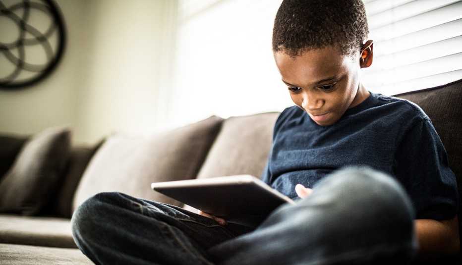 A child playing on a tablet