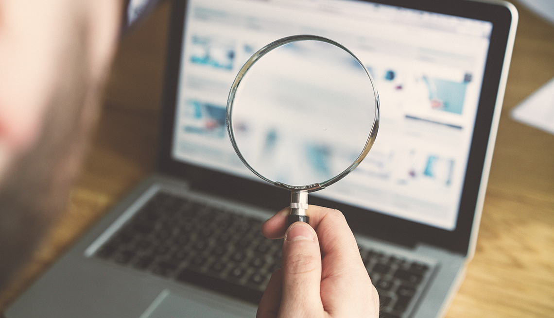 Magnifying glass and computer