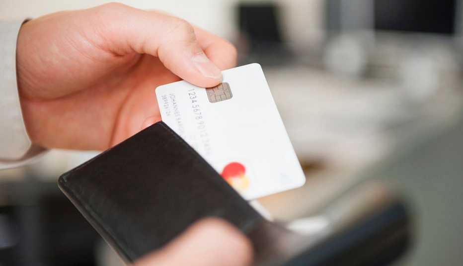 Man pulls credit card from wallet